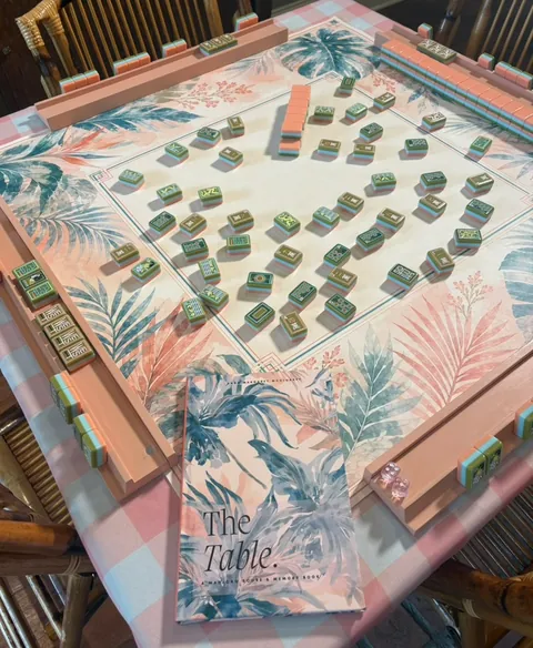 Palm Royale Tobacco Resort Mahjong mat styled with its matching scorebook